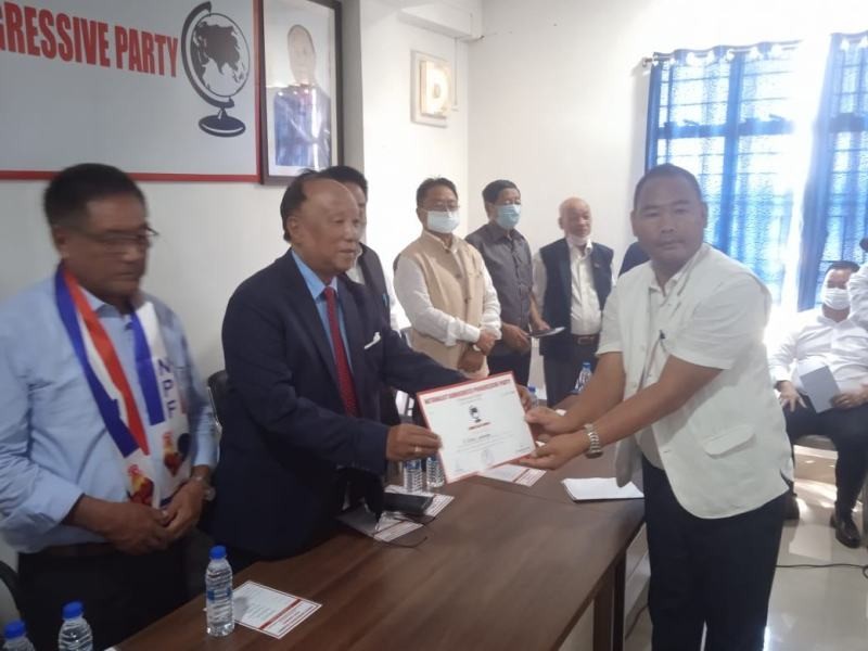 NDPP President Chingwang Konyak, flanked by other UDA leaders, handing over the party ticket to S Keoshu Yimchunger in Dimapur on October 7.